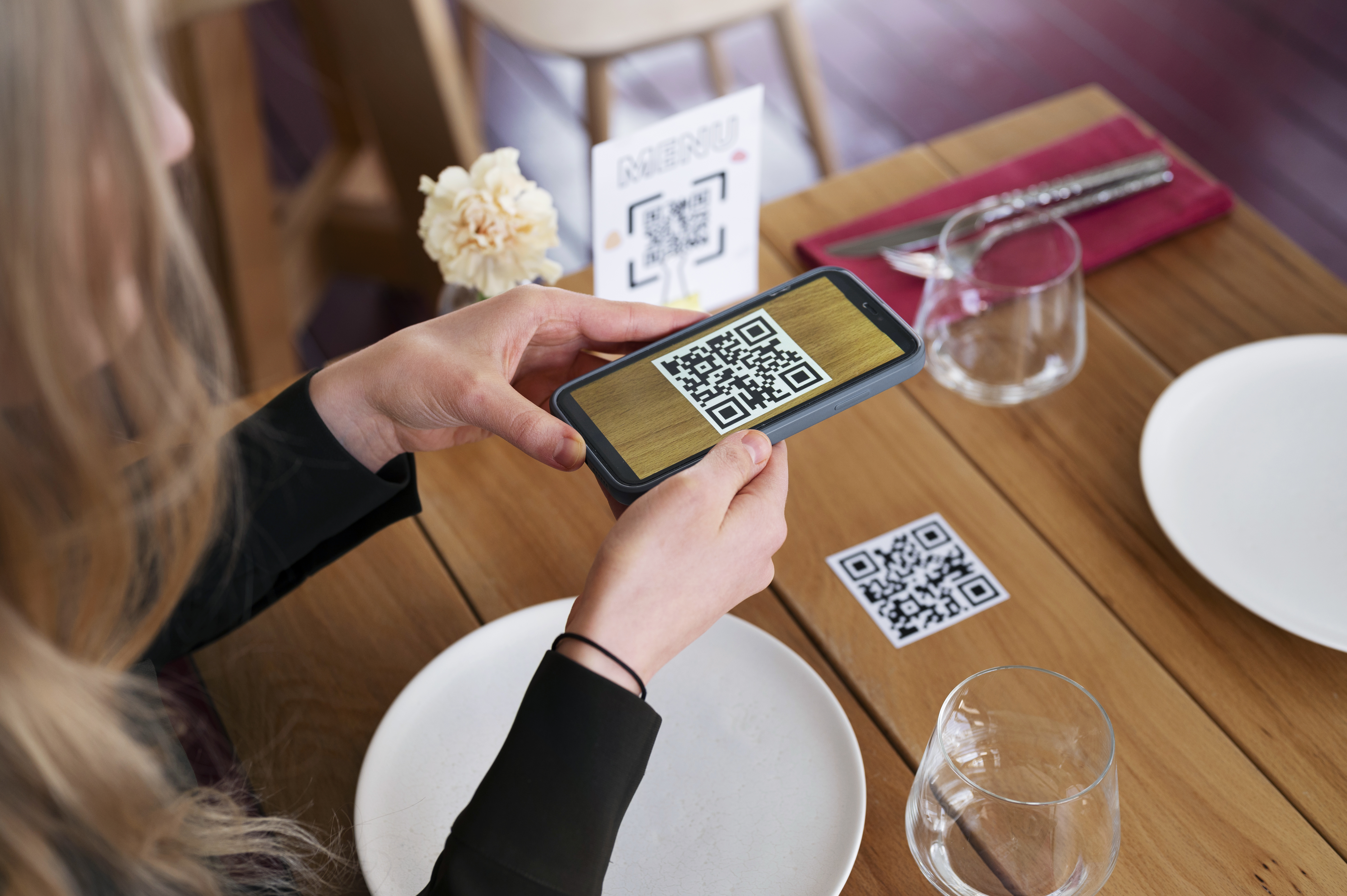 Elegant fine dining restaurant table setting with QR code menu for contactless ordering